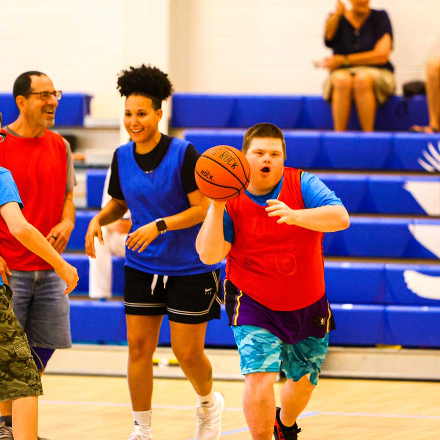 STAR participant with basketball playing in Basketball League | STARability Foundation