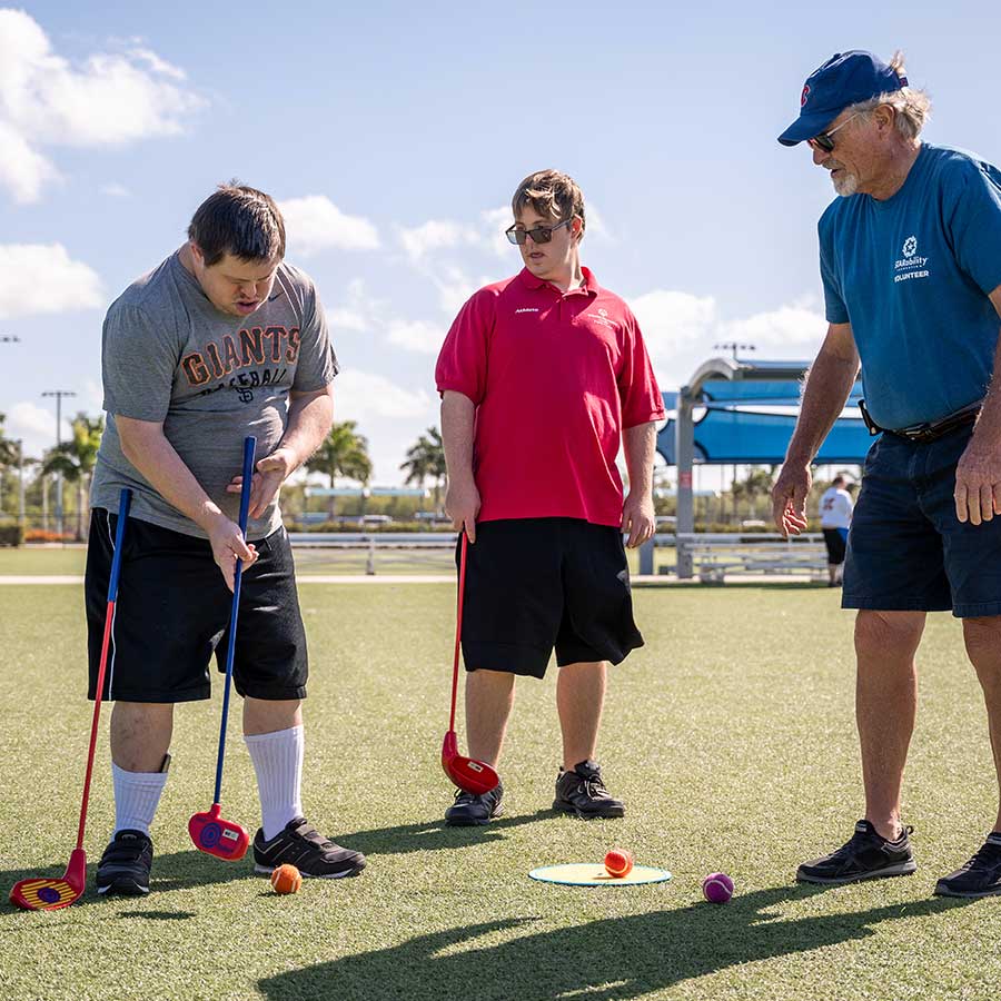 STAR participants and instructor practicing golf swing | STARability Foundation